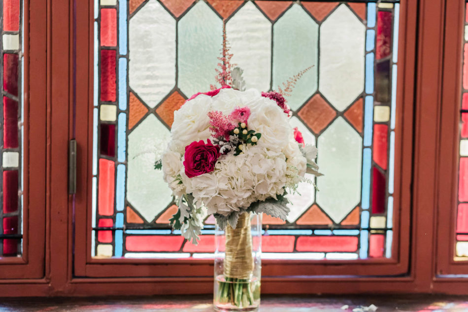 Bouquets line up by stained glass window, St. Luke's Church, Charleston, South Carolina Kate Timbers Photography. http://katetimbers.com #katetimbersphotography // Charleston Photography // Inspiration