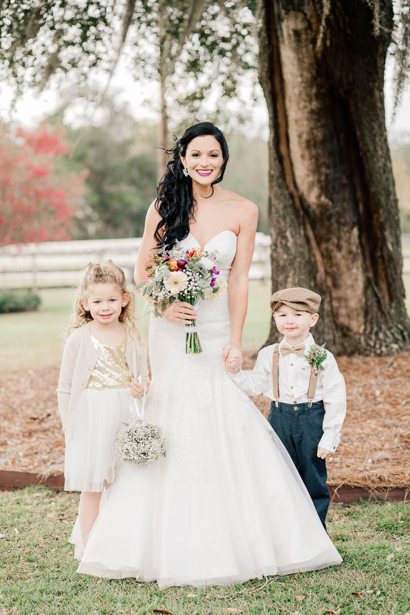 Bride poses with ring bearer and flower girl, Boals Farm, Charleston, South Carolina Kate Timbers Photography. http://katetimbers.com #katetimbersphotography // Charleston Photography // Inspiration