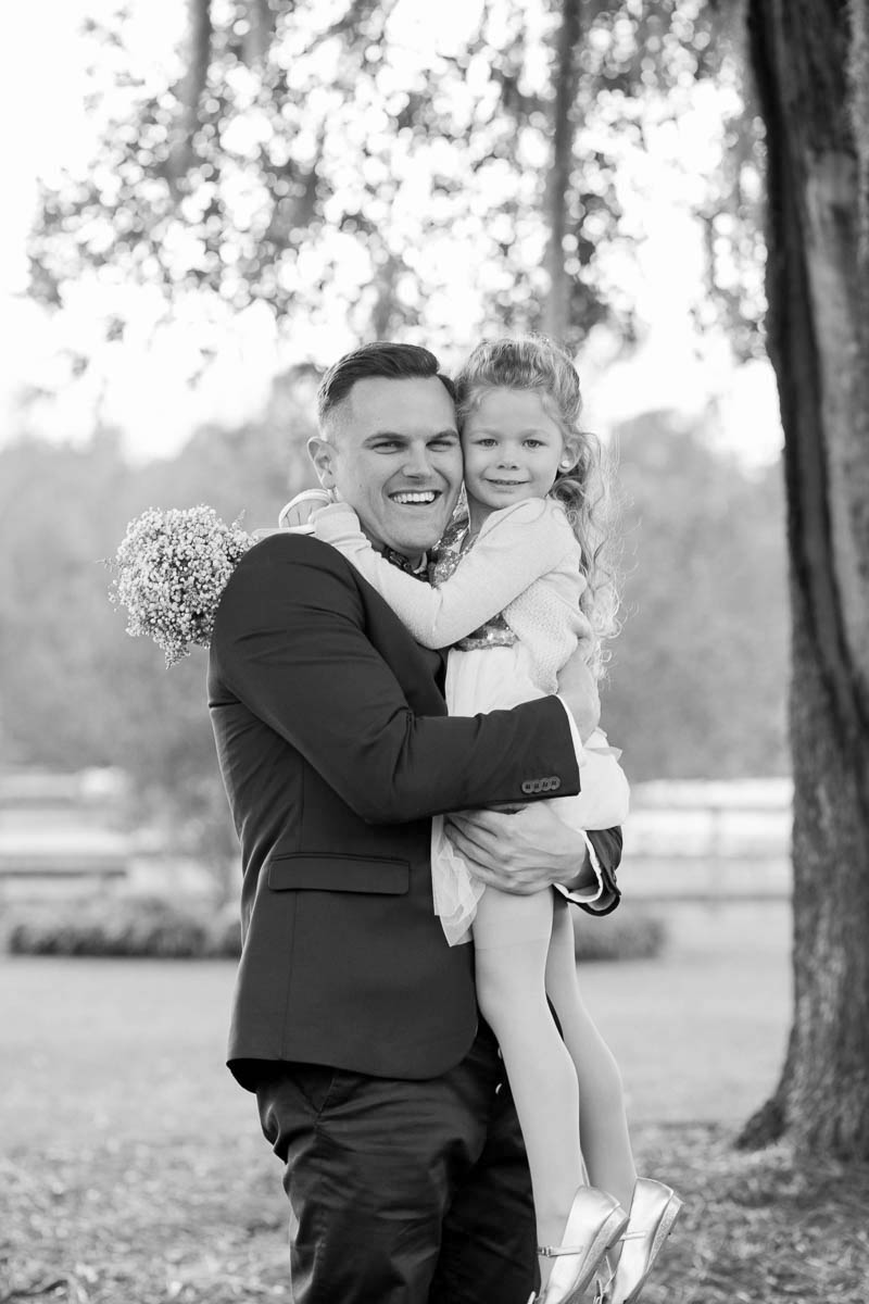 Groom poses with flower girl, Boals Farm, Charleston, South Carolina Kate Timbers Photography. http://katetimbers.com #katetimbersphotography // Charleston Photography // Inspiration