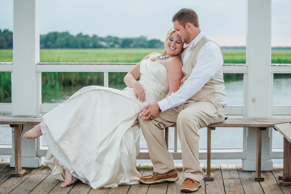 Bride and groom stand on dock at sunset, Creek Club at I'on, Charleston, South Carolina. Kate Timbers Photography. http://katetimbers.com