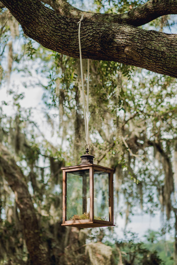 Lanterns hang from tree, Creek Club at I'on, Charleston, South Carolina. Kate Timbers Photography. http://katetimbers.com