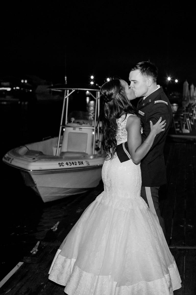 Bride and groom have bubble exit to a boat, Cottage on the Creek, Shem Creek, Charleston, South Carolina. Kate Timbers Photography. http://katetimbers.com