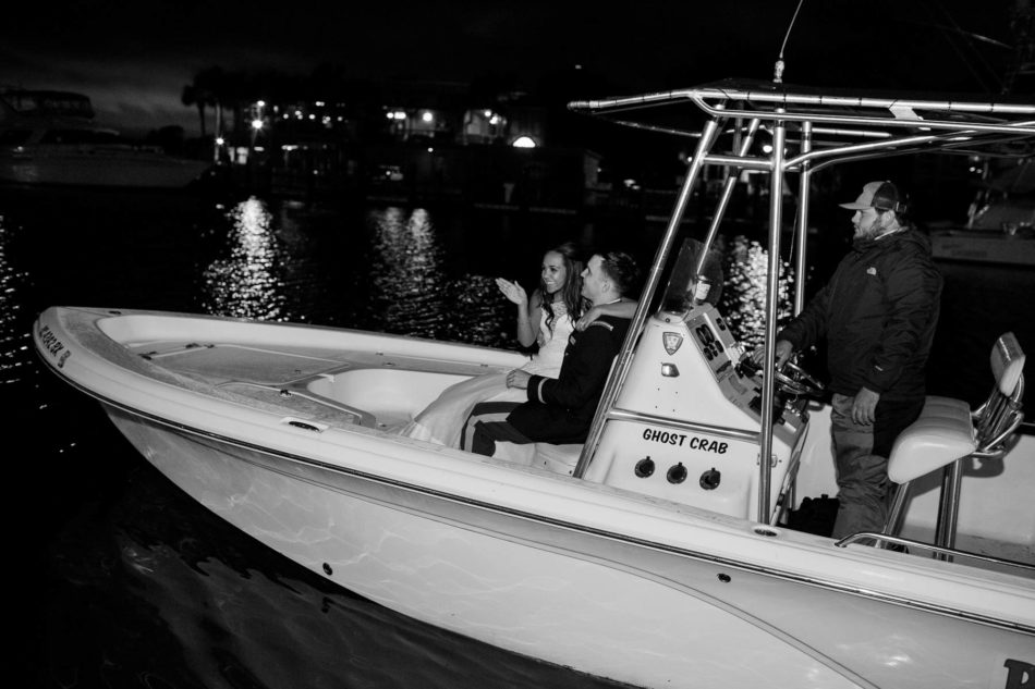 Bride and groom have bubble exit to a boat, Cottage on the Creek, Shem Creek, Charleston, South Carolina. Kate Timbers Photography. http://katetimbers.com