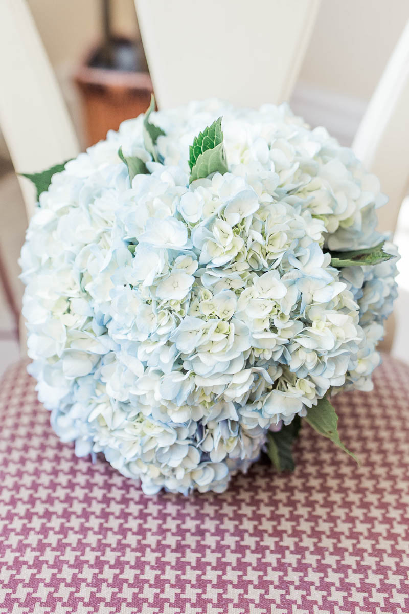 Hydrangea bouquet lays on chair, Pepper Plantation, Awendaw, South Carolina. Kate Timbers Photography. http://katetimbers.com