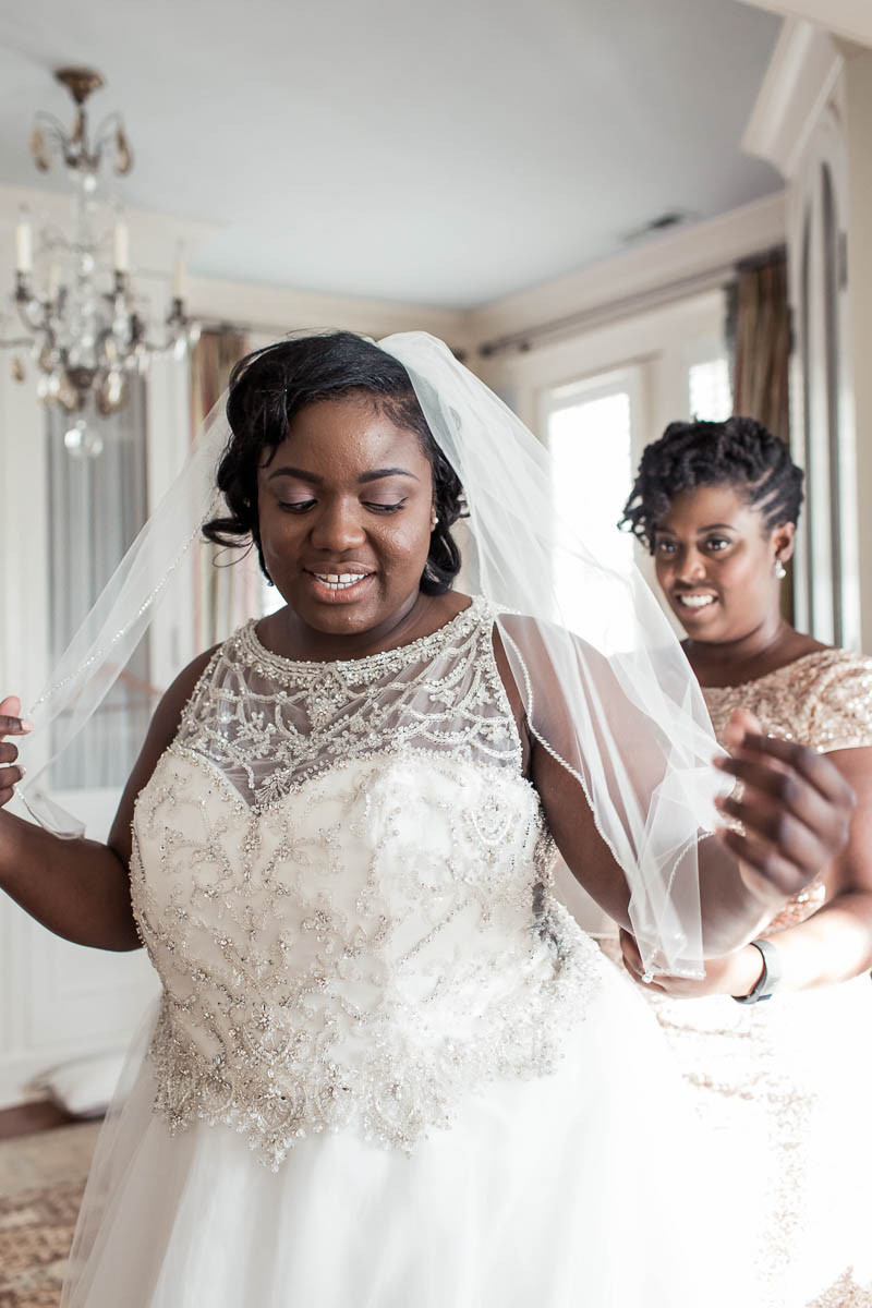 Bride gets into dress, Downtown Private Estate, Charleston. Kate Timbers Photography. http://katetimbers.com