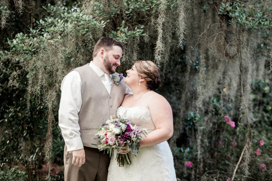 Bride and groom stand by oak tree, Magnolia Plantation. Kate Timbers Photography. http://katetimbers.com