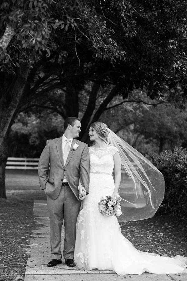 Bride and groom snuggle together, Alhambra Hall, Charleston, South Carolina. Kate Timbers Photography. http://katetimbers.com