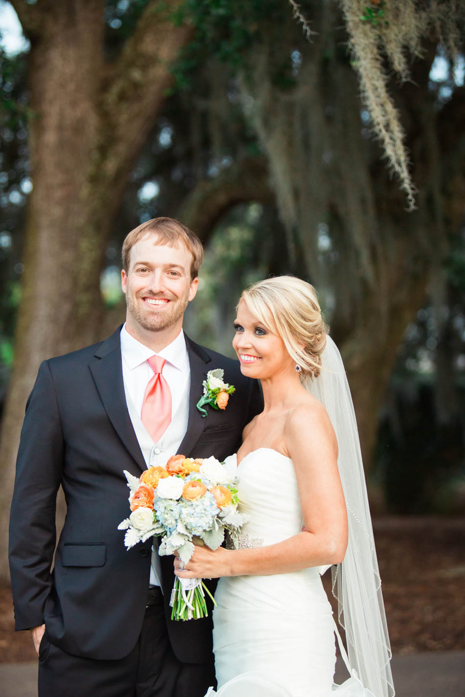 Bride and groom smile under oak trees, Dunes West Golf and River Club, Mt Pleasant, South Carolina. Kate Timbers Photography. http://katetimbers.com