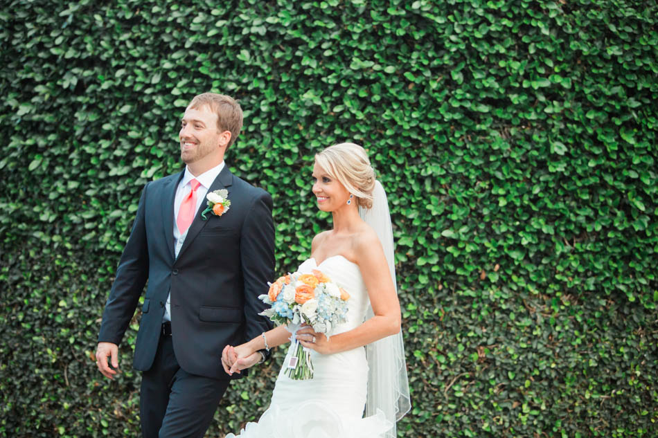 Bride and groom smile by ivy covered wall, Dunes West Golf and River Club, Mt Pleasant, South Carolina. Kate Timbers Photography. http://katetimbers.com