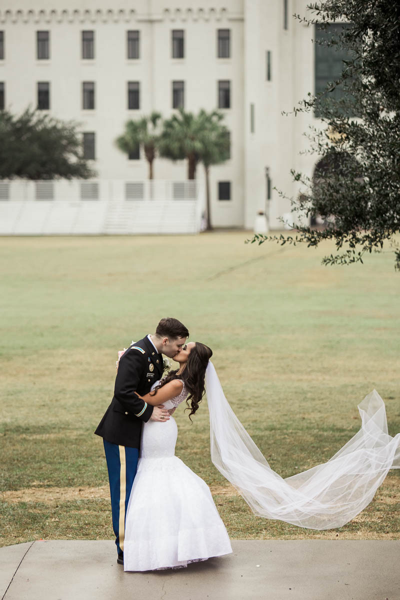 Bride and groom pose on the green, Citadel, Summerall Chapel, Charleston, South Carolina. Kate Timbers Photography. http://katetimbers.com