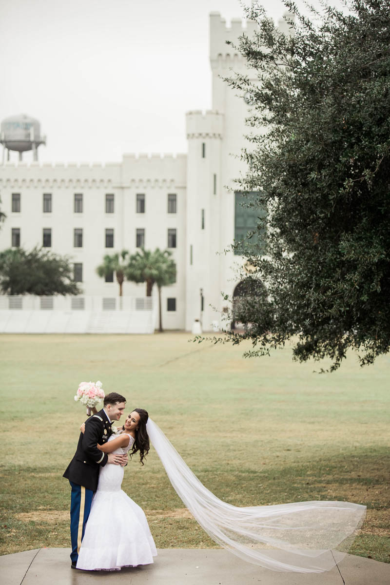 Bride and groom pose on the green, Citadel, Summerall Chapel, Charleston, South Carolina. Kate Timbers Photography. http://katetimbers.com