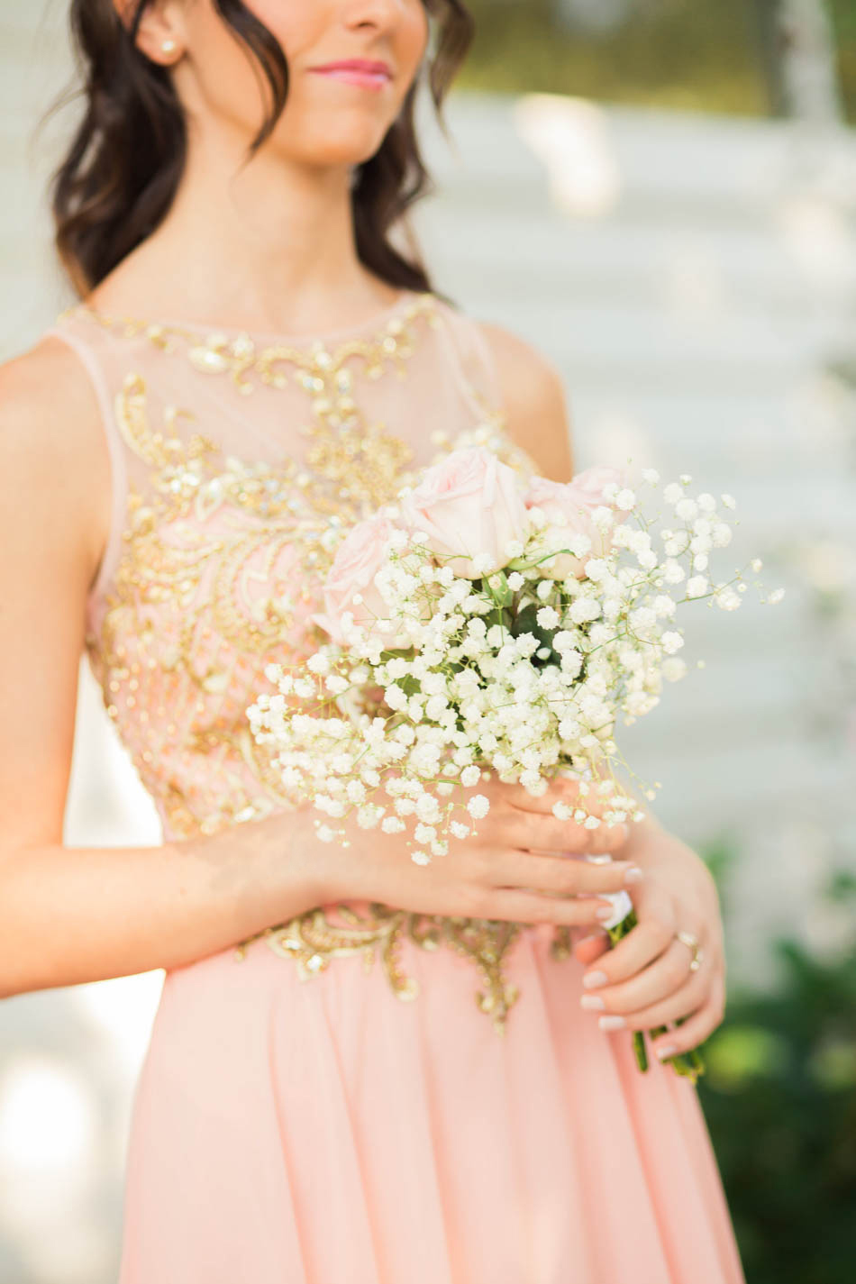 Bridesmaid holds her bouquet, Daniel Island Club. Kate Timbers Photography. http://katetimbers.com