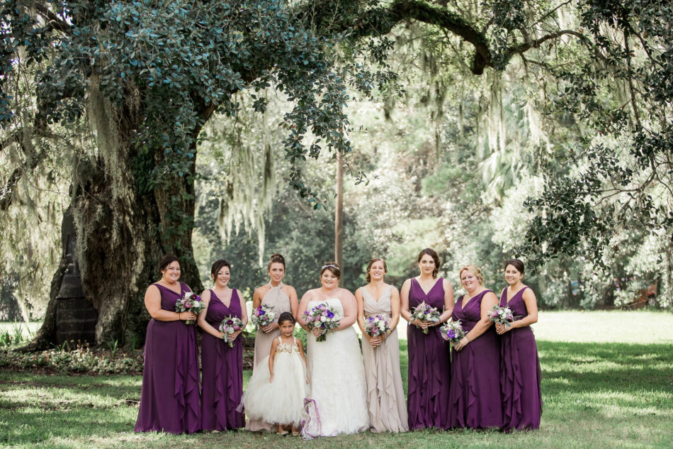 Bride and bridesmaids stand under oak tree, Magnolia Plantation. Kate Timbers Photography. http://katetimbers.com