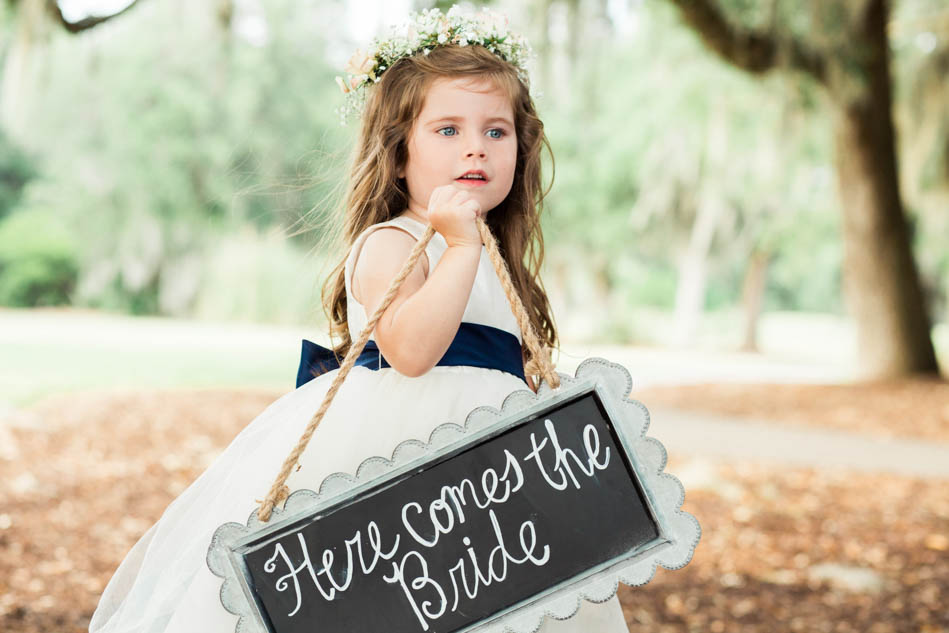 Flower girl walks down the aisle, Dunes West Golf and River Club, Mt Pleasant, South Carolina. Kate Timbers Photography. http://katetimbers.com