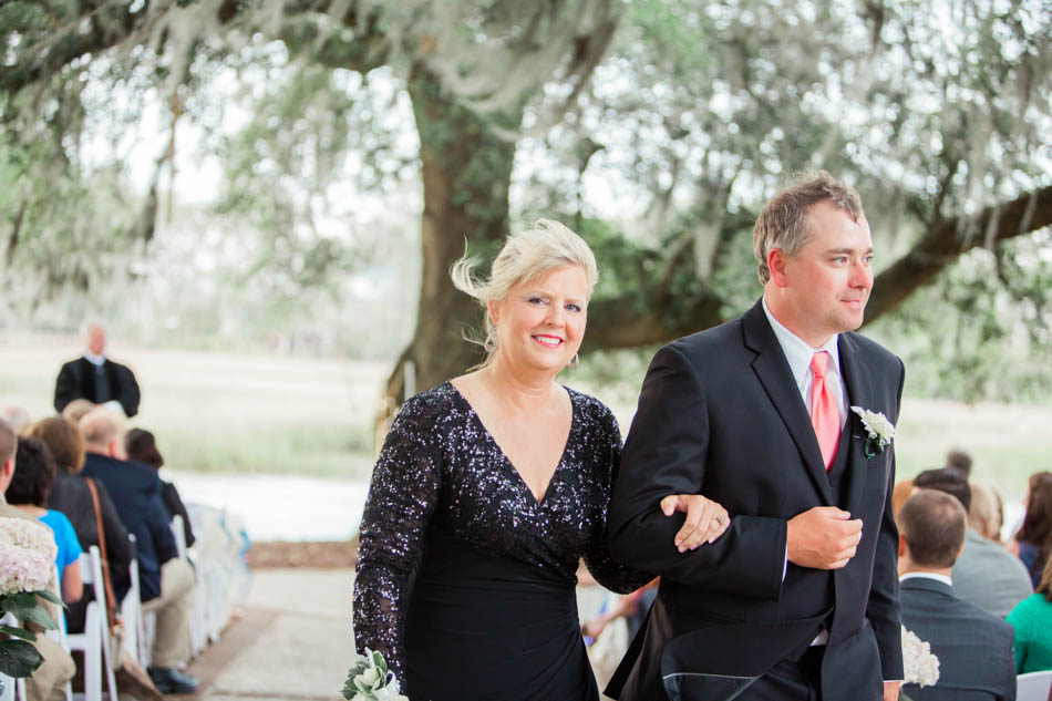 Mother is escorted down the aisle, Dunes West Golf and River Club, Mt Pleasant, South Carolina. Kate Timbers Photography. http://katetimbers.com