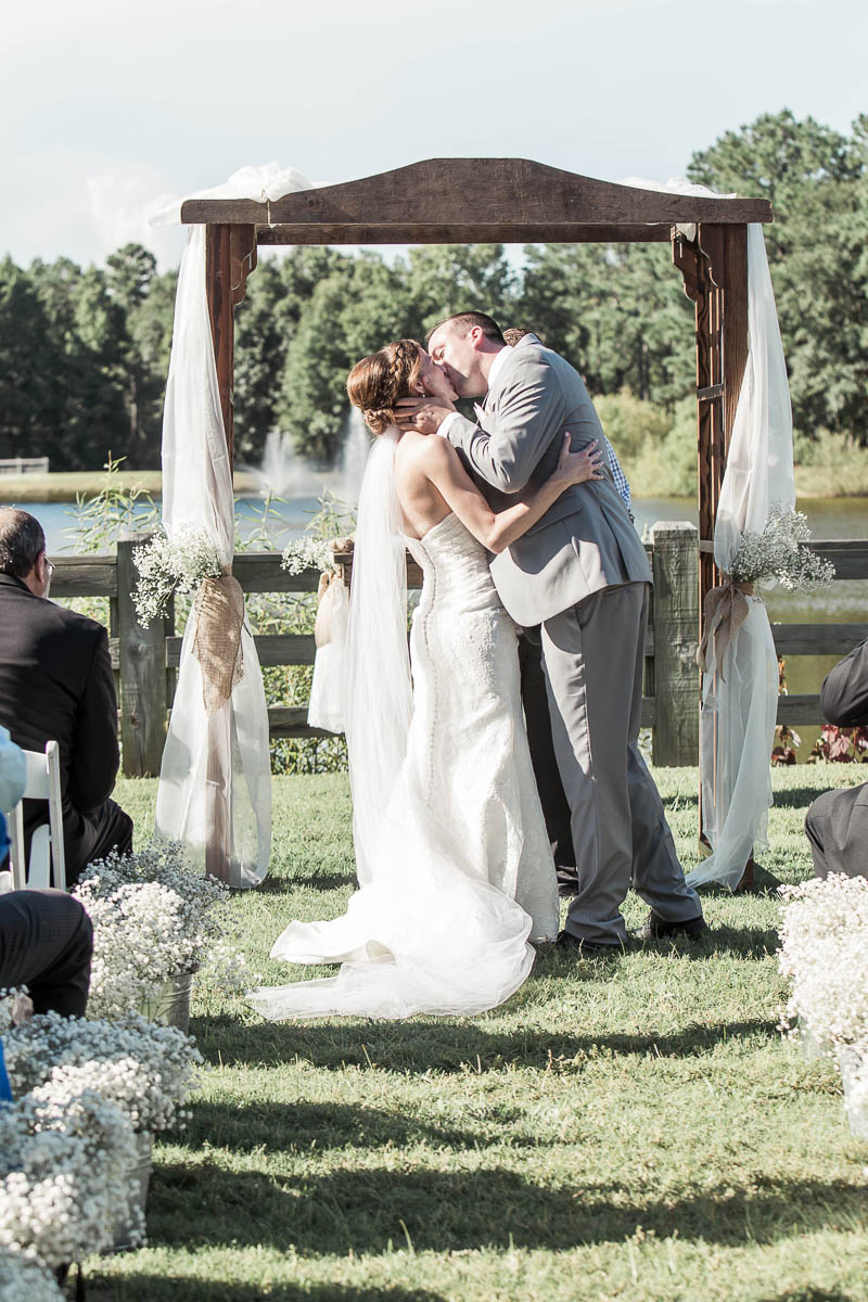 Bride and groom kiss, Pepper Plantation, Awendaw, South Carolina. Kate Timbers Photography. http://katetimbers.com