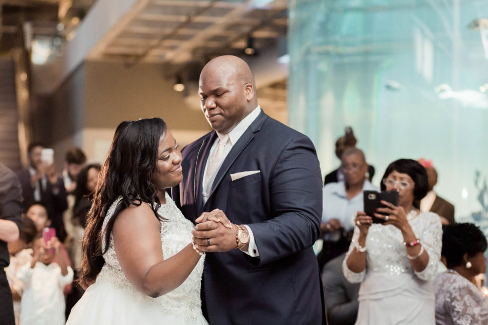 Bride and groom have their first dance, South Carolina Aquarium. Kate Timbers Photography. http://katetimbers.com