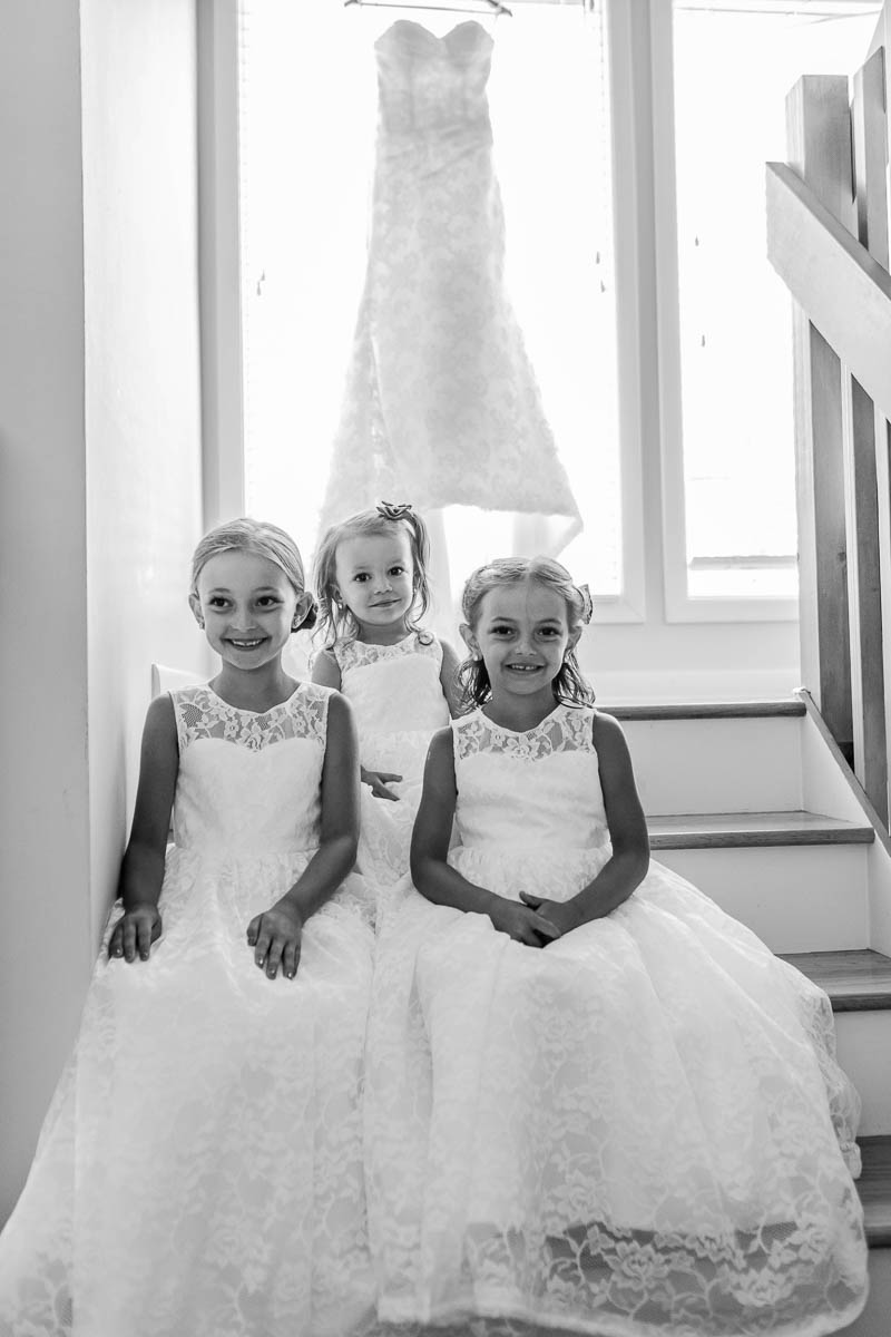 Flower girls poses for camera, Pepper Plantation, Awendaw, South Carolina. Kate Timbers Photography. http://katetimbers.com