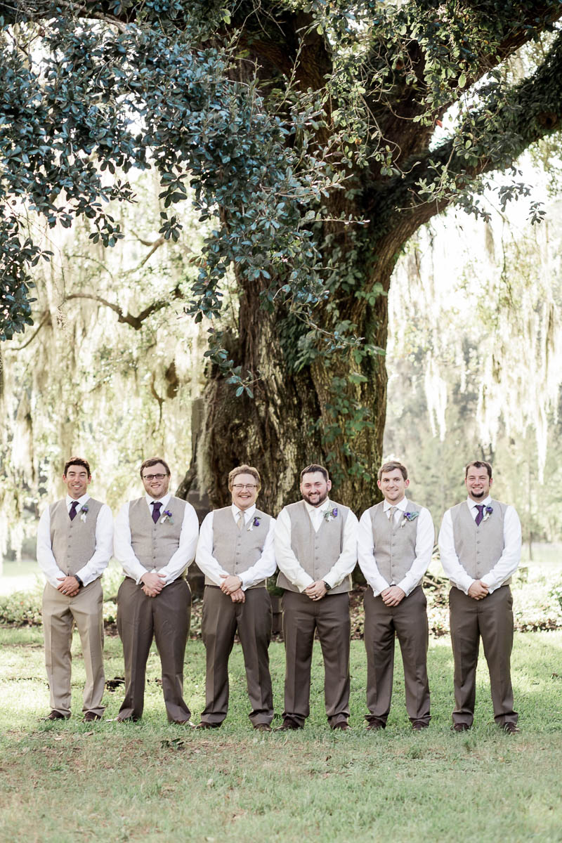Groom and groomsmen stand under oak tree, Magnolia Plantation. Kate Timbers Photography. http://katetimbers.com