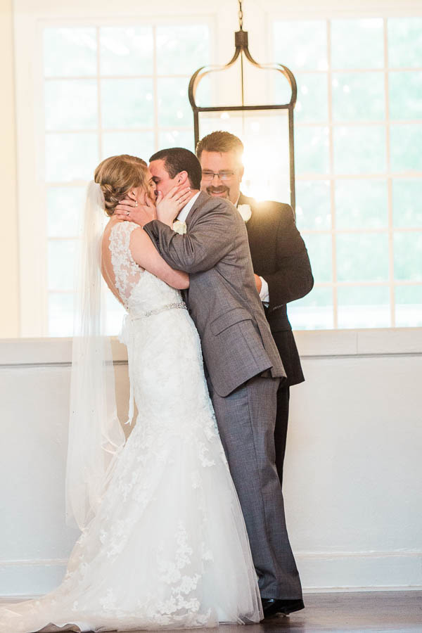 Bride and groom kiss, Alhambra Hall, Charleston, South Carolina. Kate Timbers Photography. http://katetimbers.com