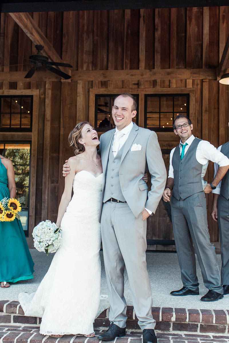 Wedding party poses in front of barn, Pepper Plantation, Awendaw, South Carolina. Kate Timbers Photography. http://katetimbers.com