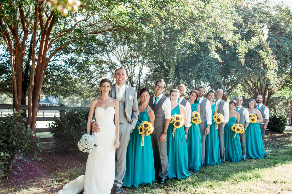 Wedding party poses in front of fence, Pepper Plantation, Awendaw, South Carolina. Kate Timbers Photography. http://katetimbers.com