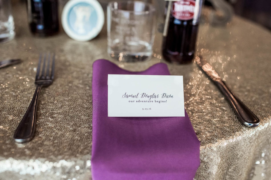 Escort cards are placed on purple napkins, Magnolia Plantation. Kate Timbers Photography. http://katetimbers.com