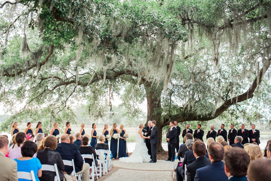 Bride and groom exchange vows under an oak tree, Dunes West Golf and River Club, Mt Pleasant, South Carolina. Kate Timbers Photography. http://katetimbers.com