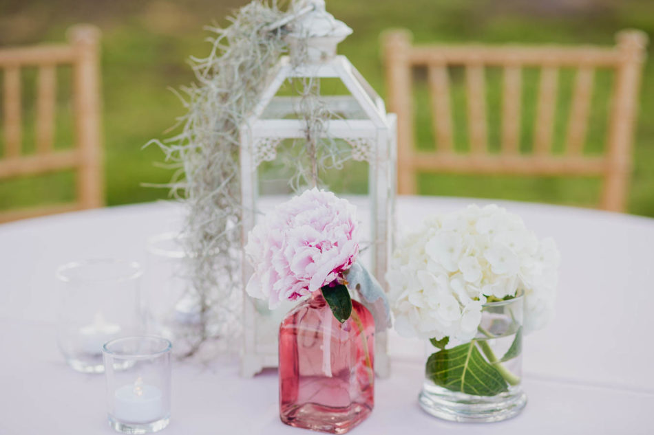 Flowers and spanish moss are placed in vintage glassware, James Island Yacht Club, Charleston, South Carolina. Kate Timbers Photography. http://katetimbers.com