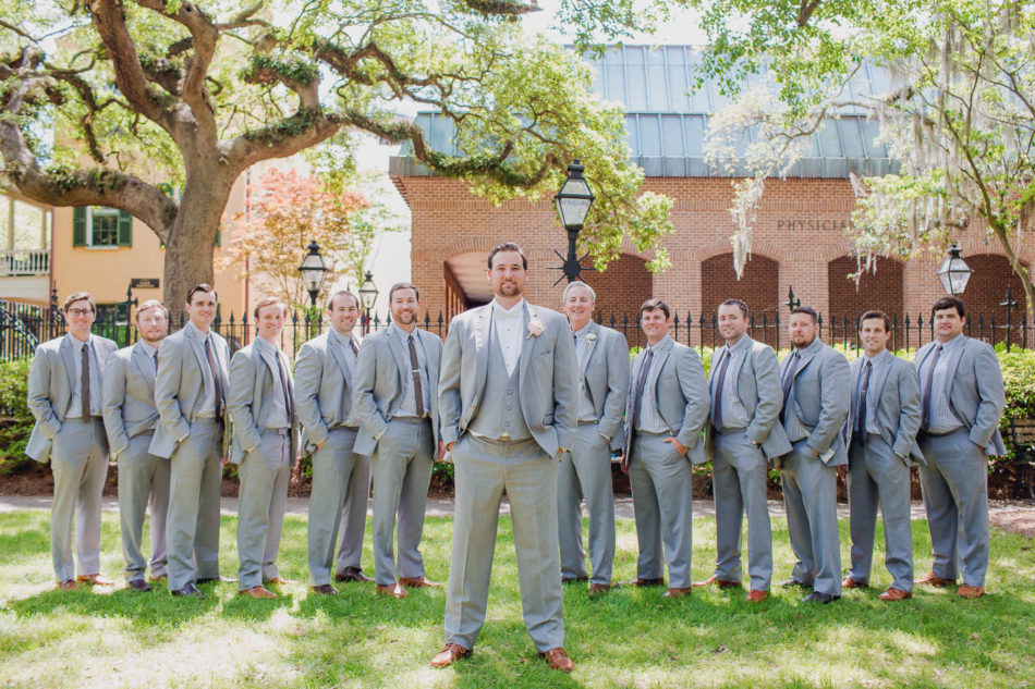 Groom and groomsmen stand in row, College of Charleston Cistern, South Carolina. Kate Timbers Photography. http://katetimbers.com