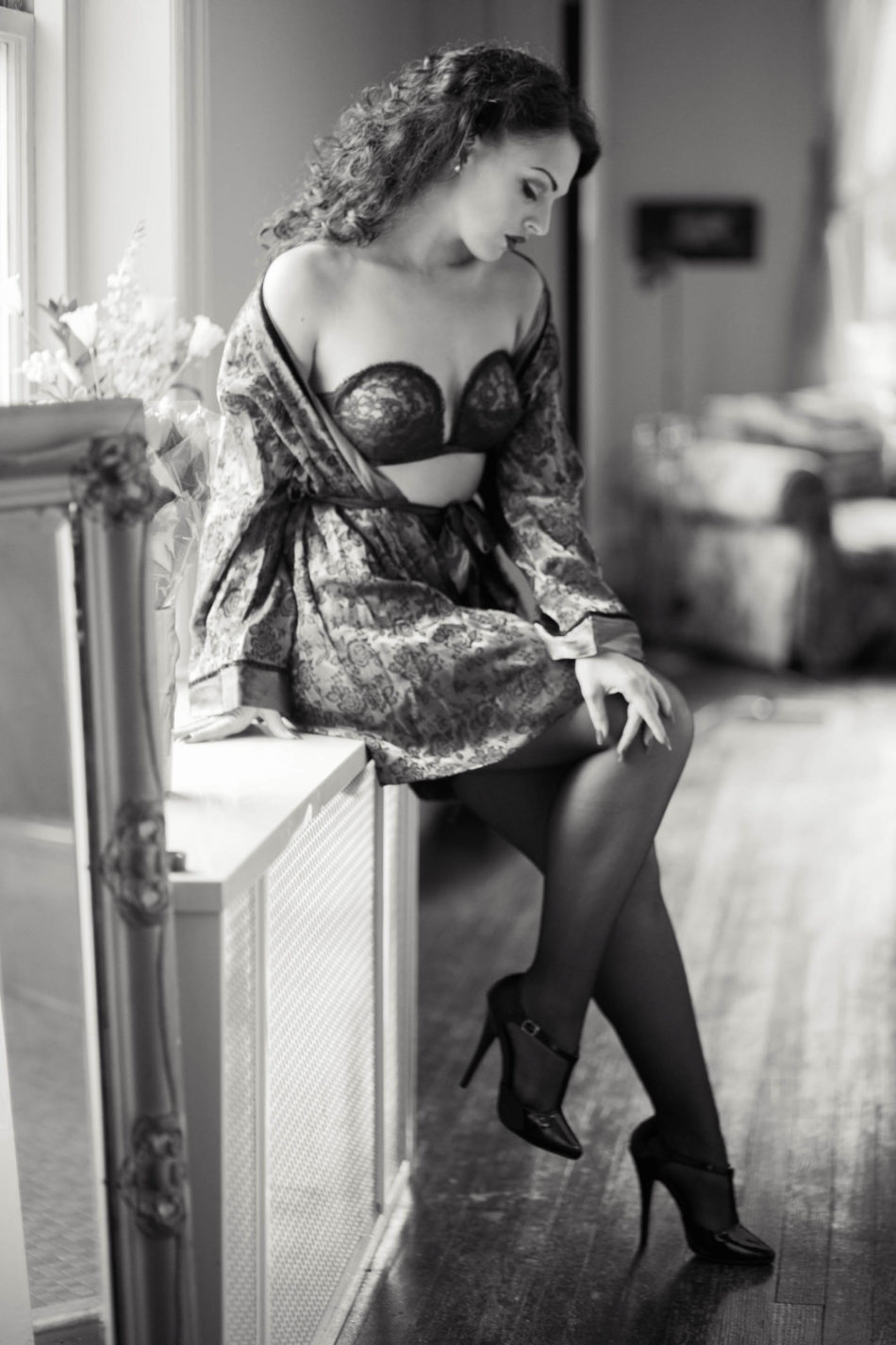 Ms A wears a retro green silk robe and lacy black lingerie outfit with stockings and heels, Boudoir Photography, Charleston, SC. Kate Timbers Photography. http://katetimbers.com