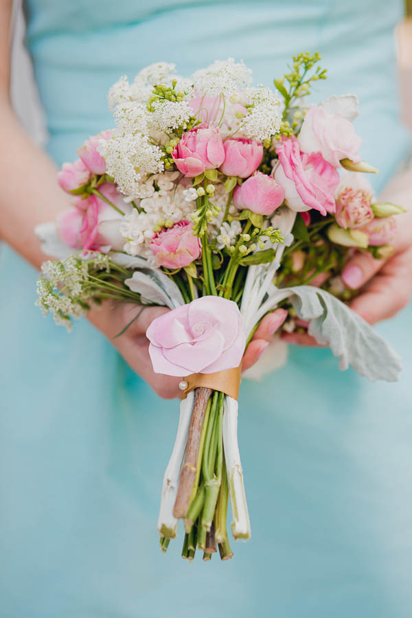 Bridesmaid holds pink, white, and green bouquet by Wildflowers Inc, College of Charleston Cistern, South Carolina. Kate Timbers Photography. http://katetimbers.com