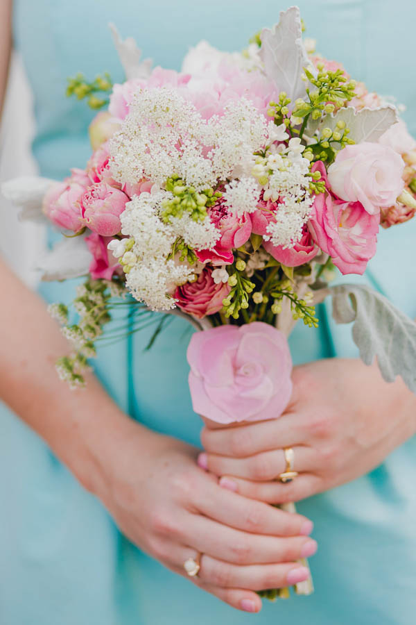 Bridesmaid holds pink, white, and green bouquet by Wildflowers Inc, College of Charleston Cistern, South Carolina. Kate Timbers Photography. http://katetimbers.com