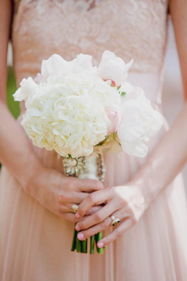 Bridesmaid holds bouquet, Brookgreen Gardens wedding, Murrells Inlet, South Carolina. Kate Timbers Photography. http://katetimbers.com