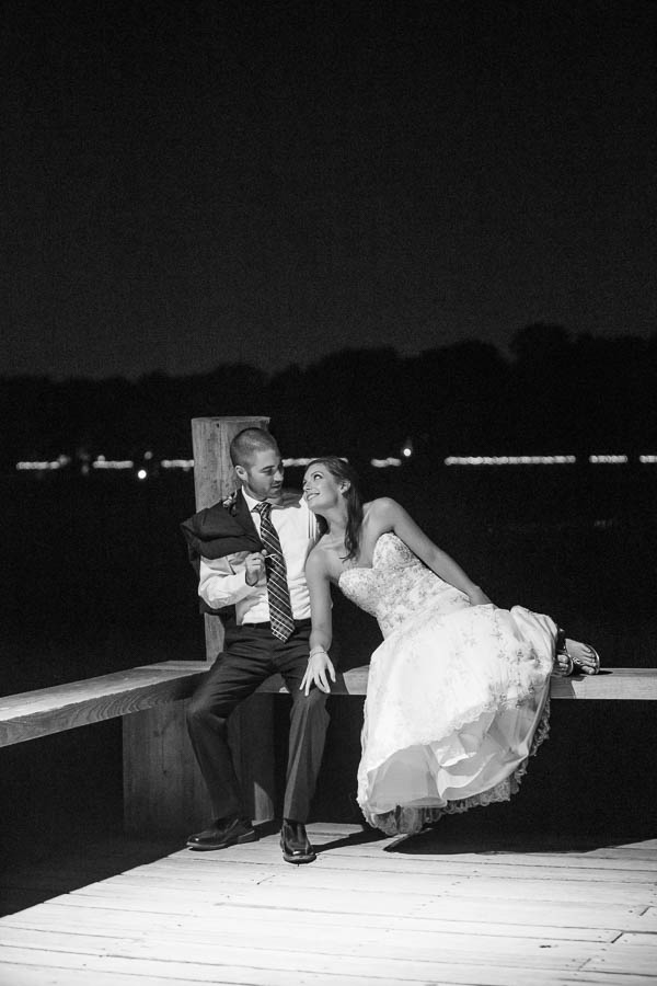 Bride and groom sit on dock at night, Boone Hall Plantation, Charleston, South Carolina. Kate Timbers Photography. http://katetimbers.com