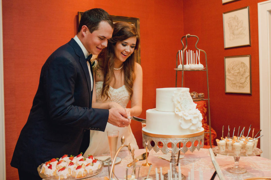 Bride and groom cut cake, Brookgreen Gardens, Murrells Inlet, South Carolina. Kate Timbers Photography. http://katetimbers.com