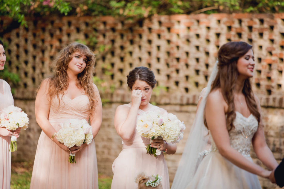Bridesmaids tear up at ceremony, Brookgreen Gardens, Murrells Inlet, South Carolina. Kate Timbers Photography. http://katetimbers.com