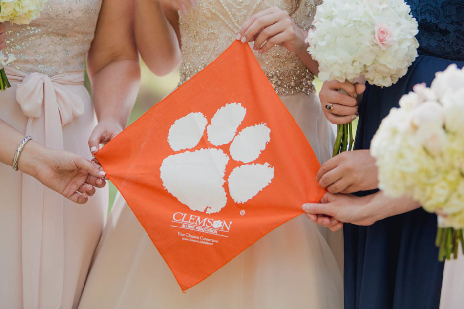 Bride and bridesmaids hold Clemson Cougars flag, Brookgreen Gardens, Murrells Inlet, South Carolina. Kate Timbers Photography. http://katetimbers.com