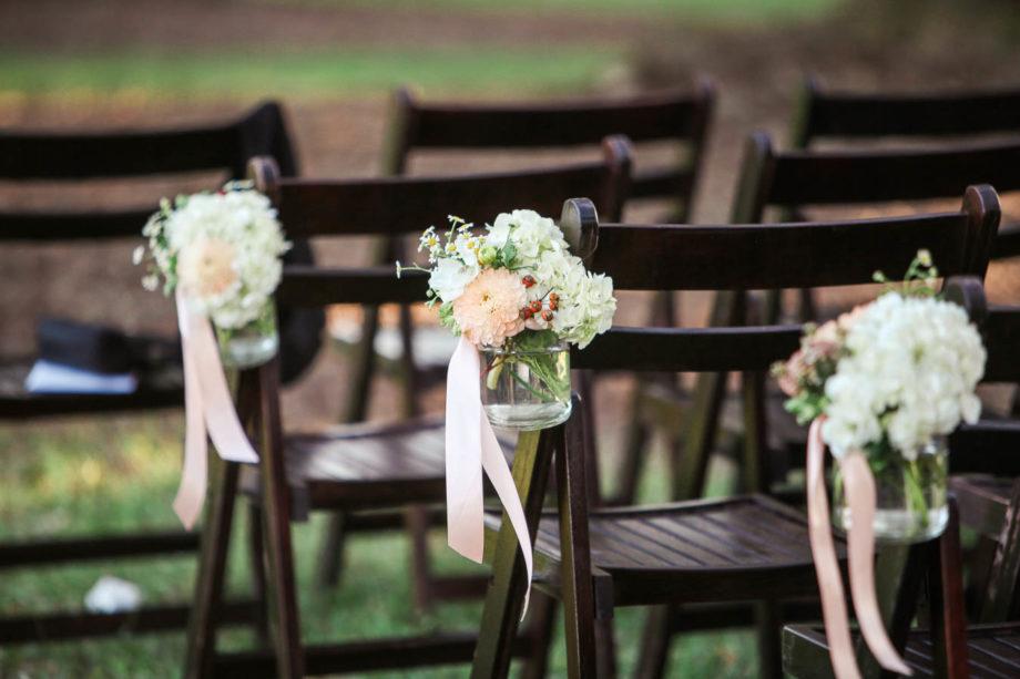 Flowers in jars are tied to chairs, Boone Hall Plantation, Charleston, South Carolina. Kate Timbers Photography. http://katetimbers.com