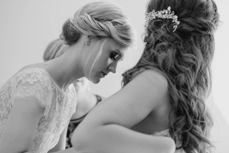 Bride gets into dress, Brookgreen Gardens, Murrells Inlet, South Carolina. Kate Timbers Photography. http://katetimbers.com