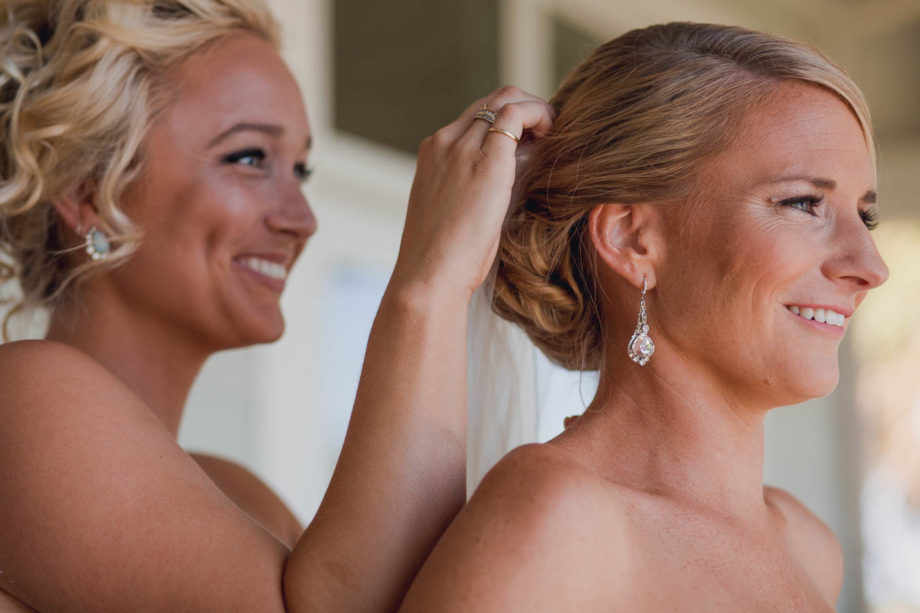Bride gets hair styled, Cottages on Charleston Harbor, Mt Pleasant, South Carolina. Kate Timbers Photography. http://katetimbers.com