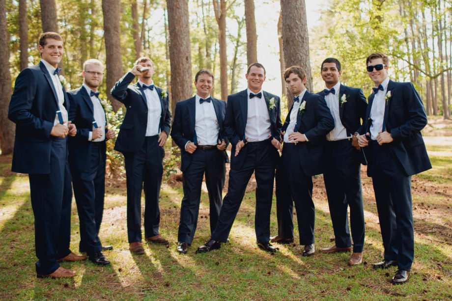 Groom poses with groomsmen, Brookgreen Gardens, Murrells Inlet, South Carolina. Kate Timbers Photography. http://katetimbers.com