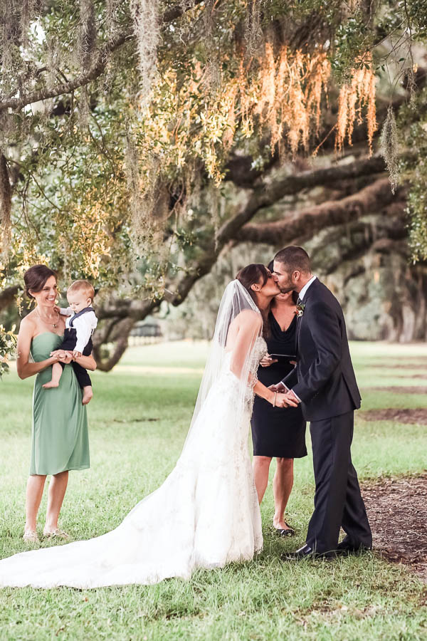 Bride and groom kiss, Boone Hall Plantation, Charleston, South Carolina. Kate Timbers Photography. http://katetimbers.com