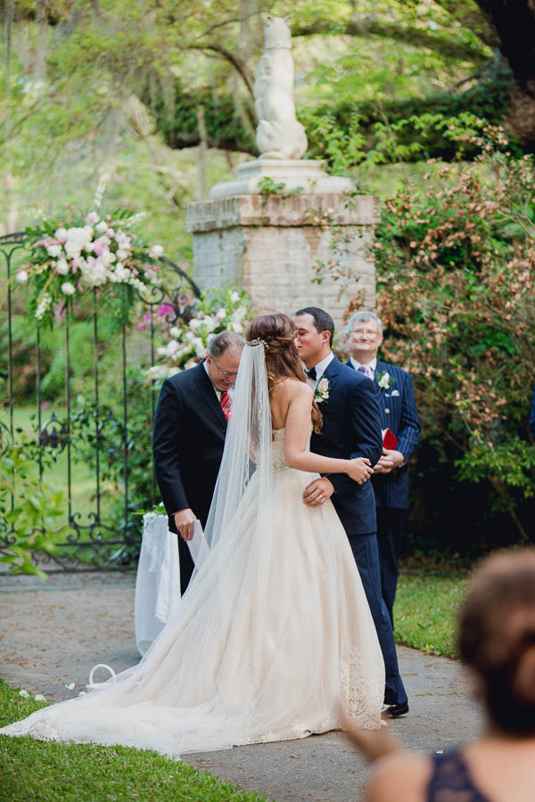 Bride and groom kiss, Brookgreen Gardens, Murrells Inlet, South Carolina. Kate Timbers Photography. http://katetimbers.com