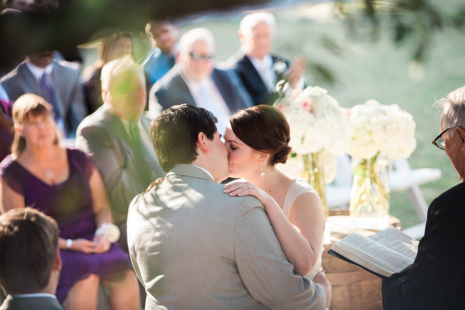 Bride and groom kiss, Creek Club at I'on, Charleston, South Carolina. Kate Timbers Photography. http://katetimbers.com