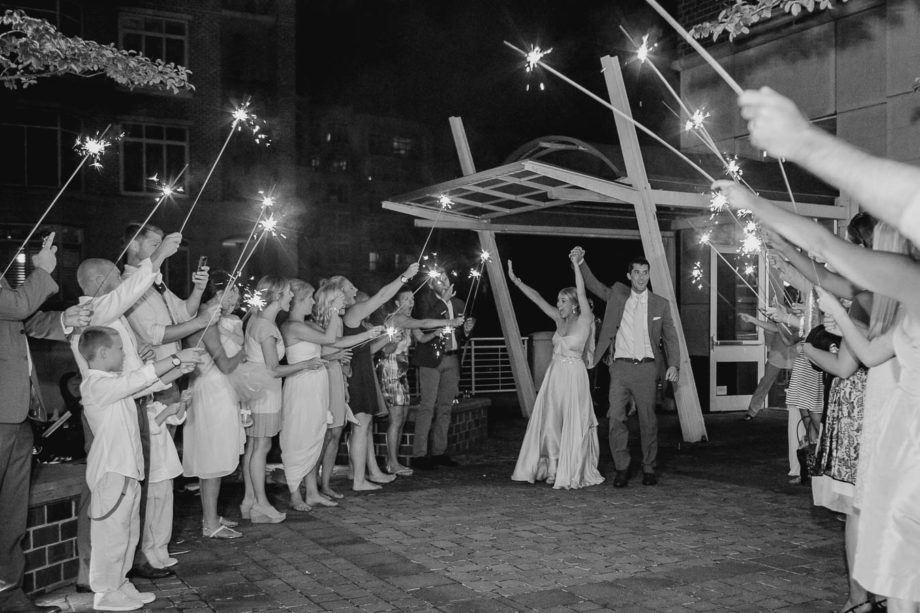 Bride and groom have a sparkler exit, Harborside East, Mt Pleasant, South Carolina. Kate Timbers Photography. http://katetimbers.com