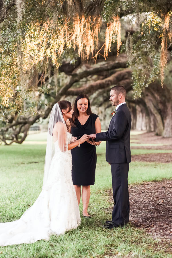 Bride and groom exchange vows, Boone Hall wedding, Charleston, South Carolina. Kate Timbers Photography. http://katetimbers.com