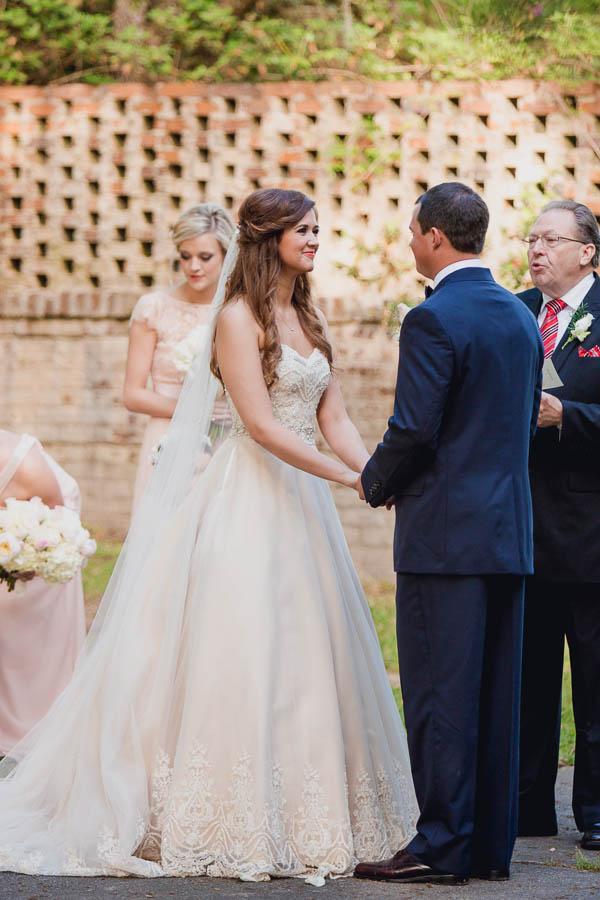 Bride and groom exchange vows, Brookgreen Gardens, Murrells Inlet, South Carolina. Kate Timbers Photography. http://katetimbers.com