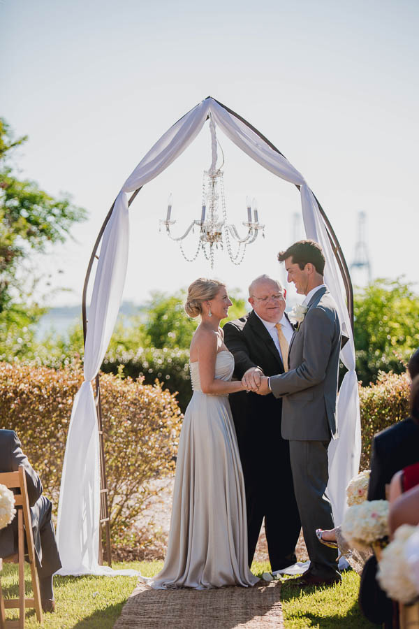 Bride and groom exchange vows, Harborside East, Mt Pleasant, South Carolina. Kate Timbers Photography. http://katetimbers.com