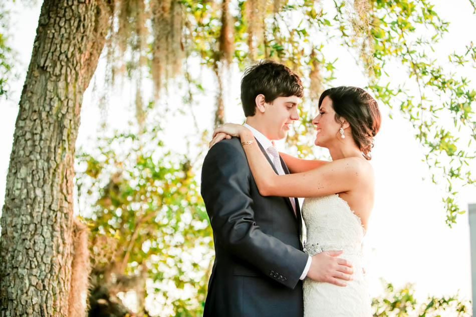 Bride and groom stand under oak tree at sunset, I'ON Creek Club, Mt Pleasant, South Carolina Kate Timbers Photography. http://katetimbers.com #katetimbersphotography // Charleston Photography // Inspiration